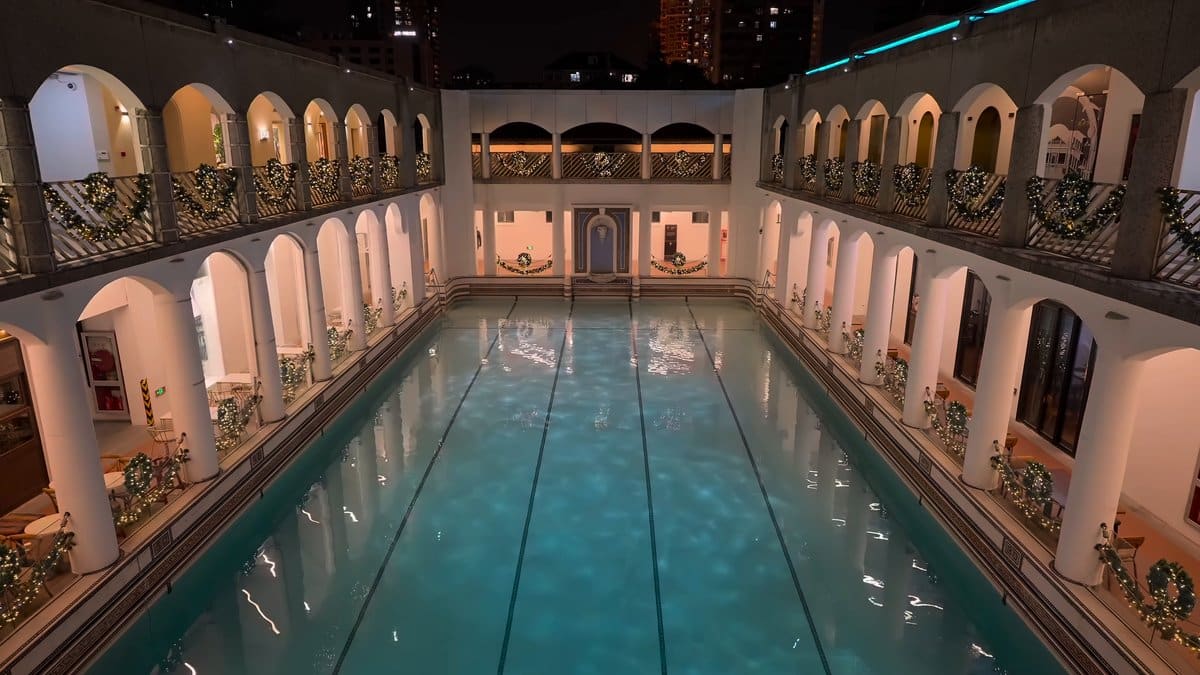 Historic open-air pool lit at night