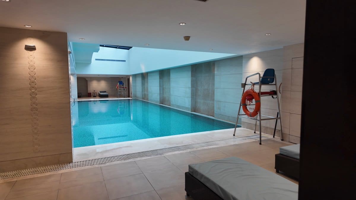 Indoor turquoise tiled swimming pool