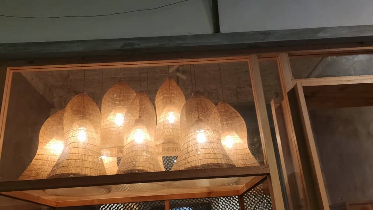 Inside a shop, a row of woven basket