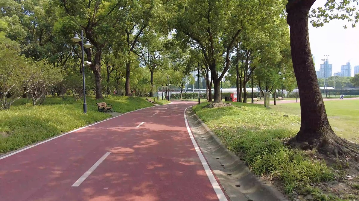Jogging track beside city towers