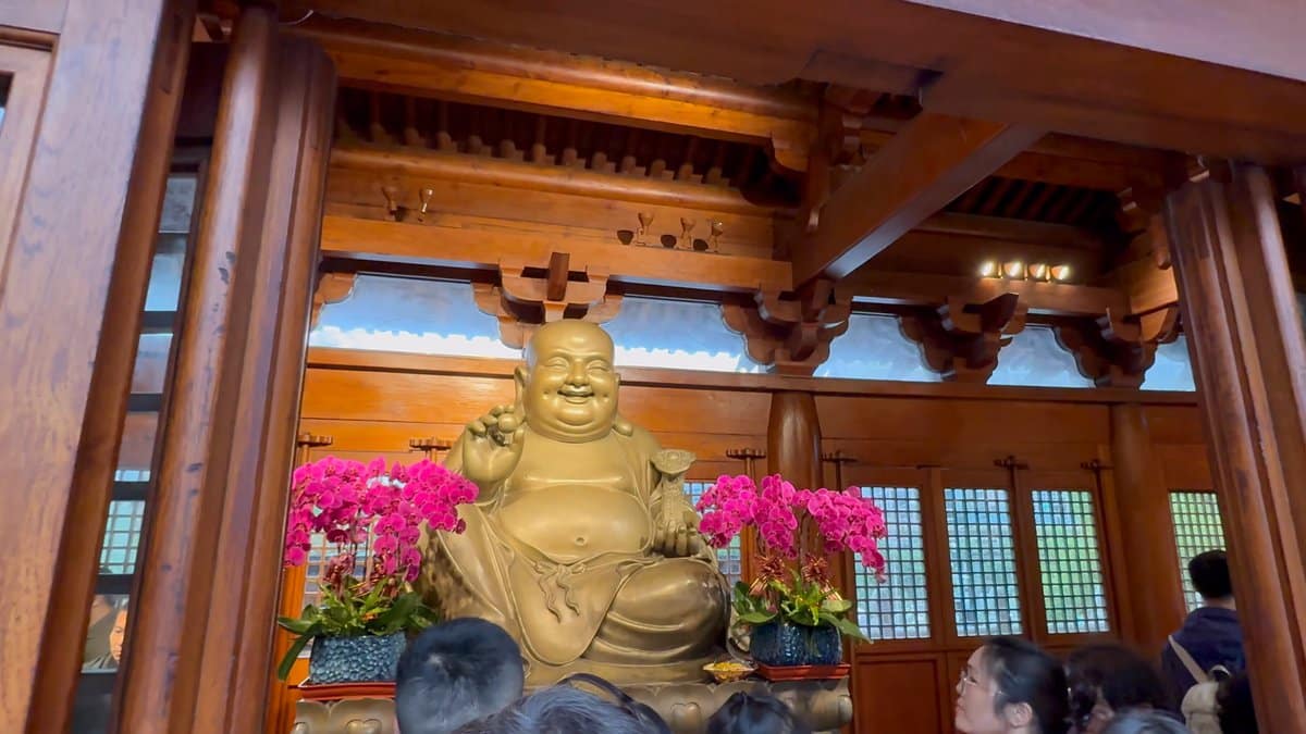 Laughing Maitreya with orchids