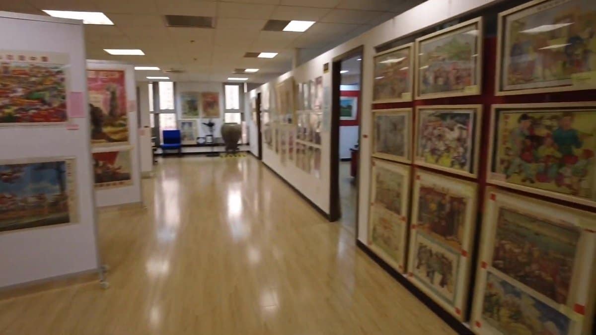Long gallery of framed propaganda art