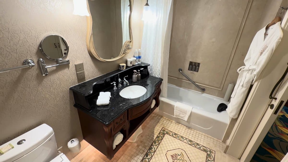 Marble bathroom with carved vanity