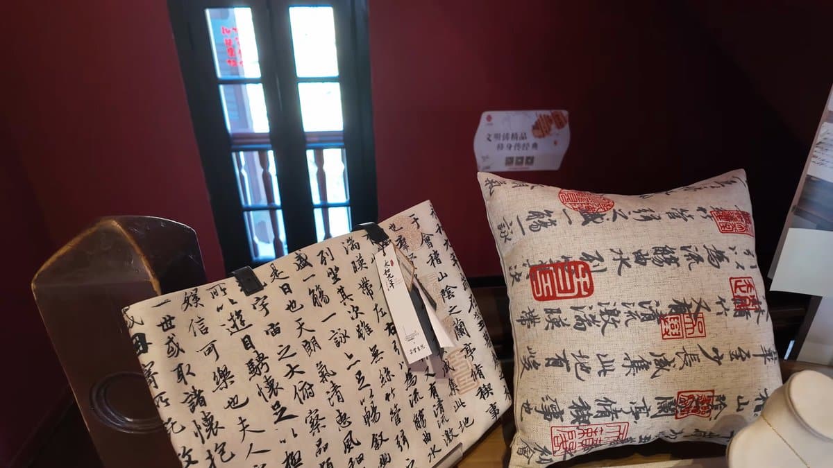 Merchandise on display — cushions and a tote
