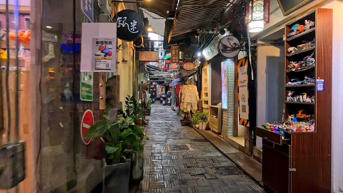 Narrow shikumen lane after rain