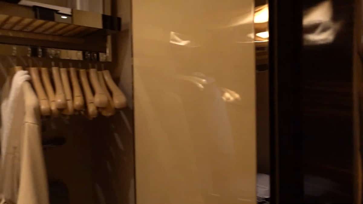 Open wardrobe with hanging robe