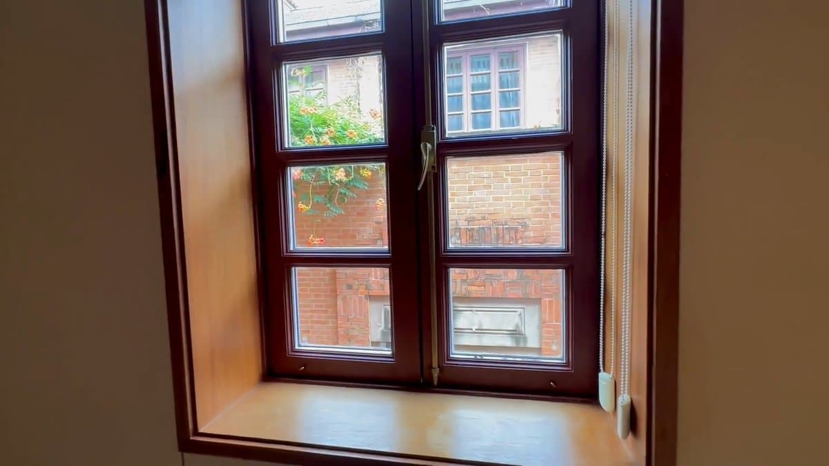 Open window onto brick courtyard