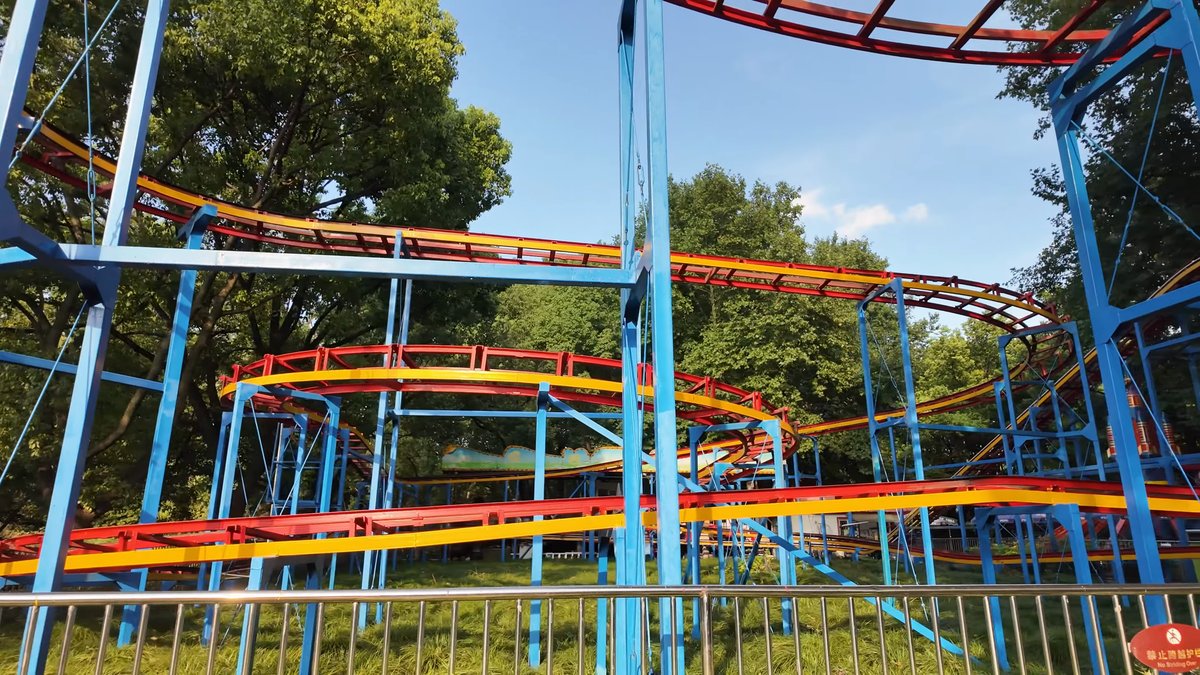 Orange and blue coaster among trees