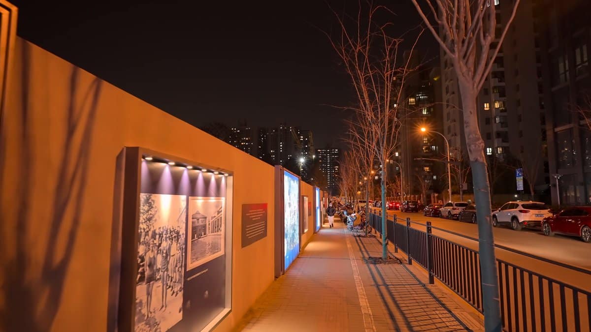 Orange-lit photographic display wall