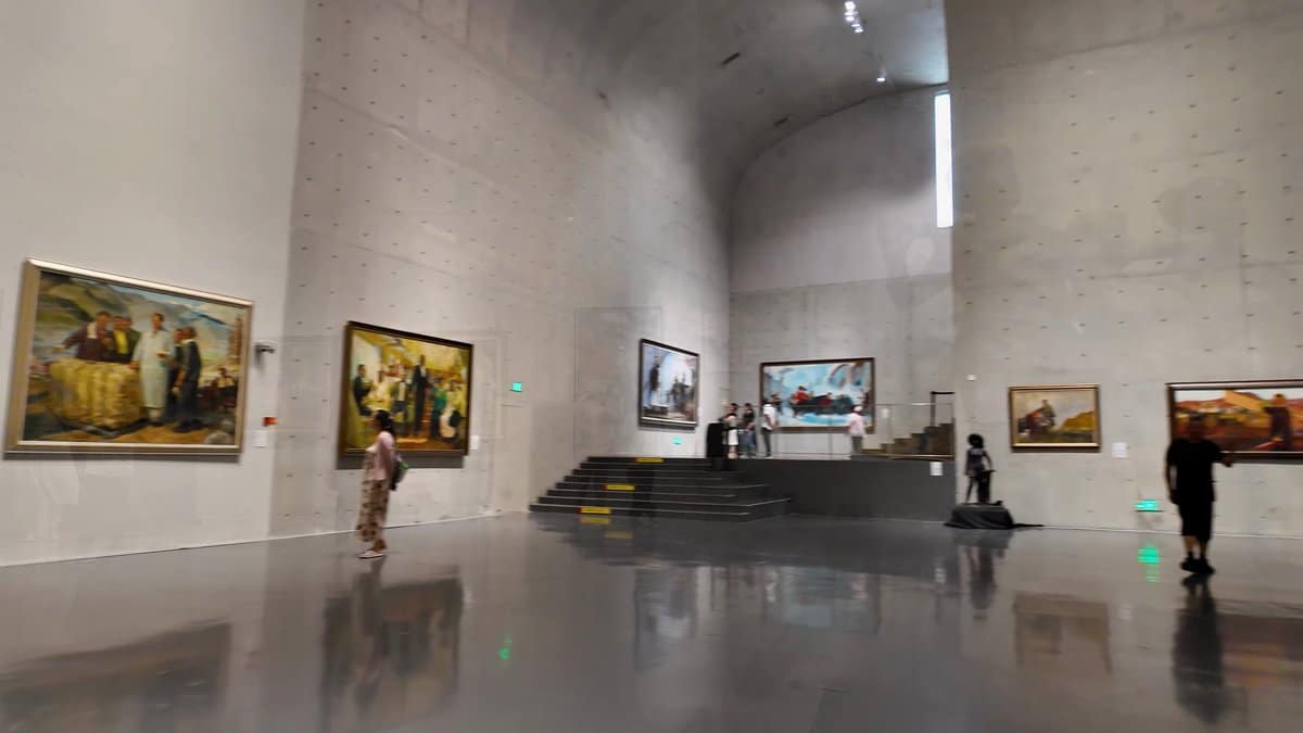 Paintings lining the vaulted gallery
