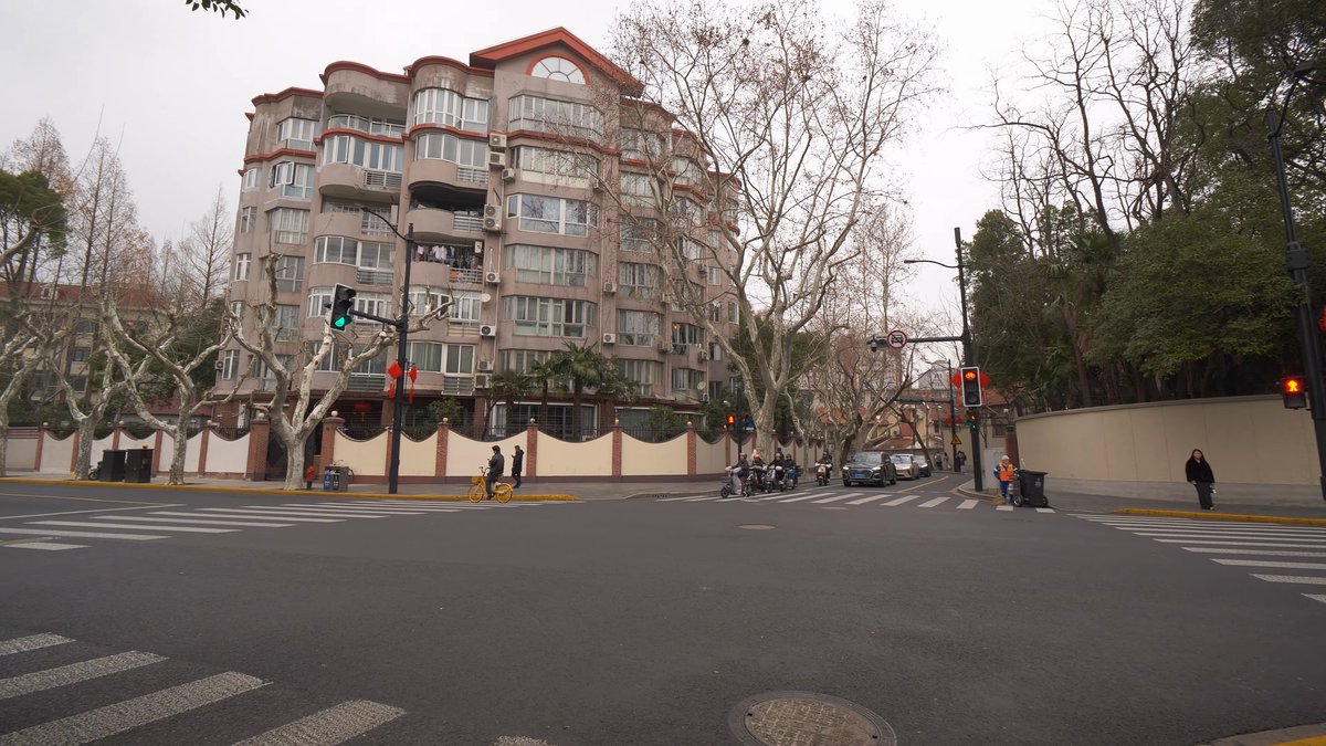 Pale apartment block with balconies
