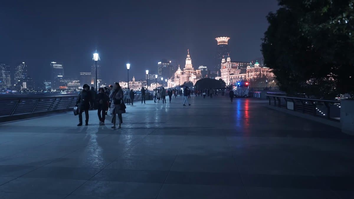 Pedestrians on the granite promenade