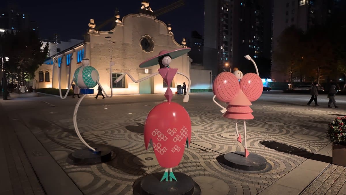 Pink sculptures on the night plaza