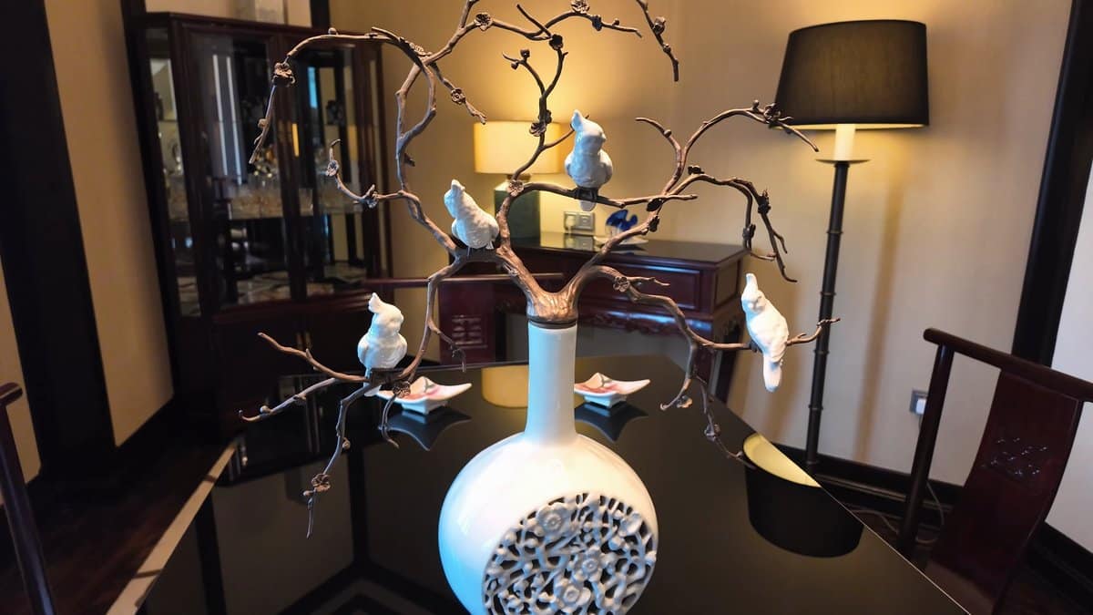 Porcelain birds on metal branch