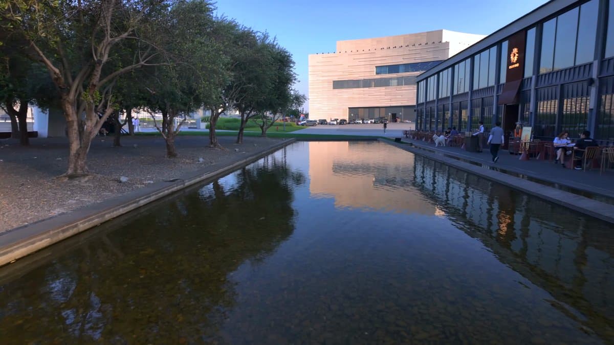 Reflecting pool beside a glass hall