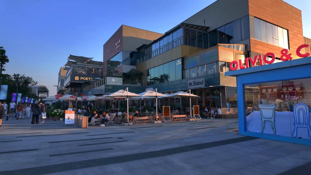 Retail plaza glowing in evening light
