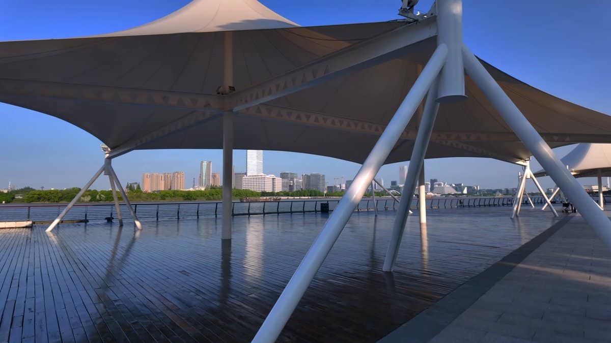 River framed by steel canopy masts