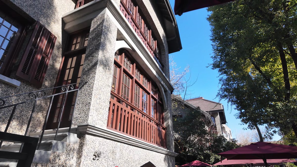 Stone villa above cafe parasols
