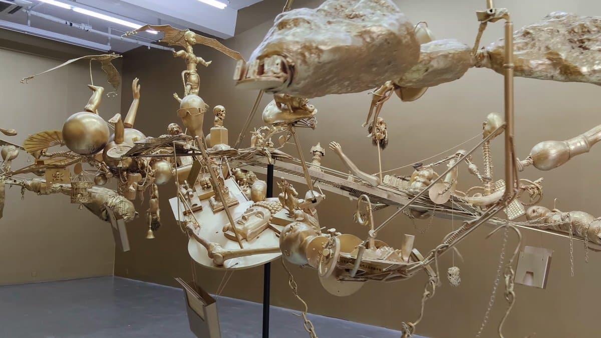 Suspended figures hanging from the ceiling