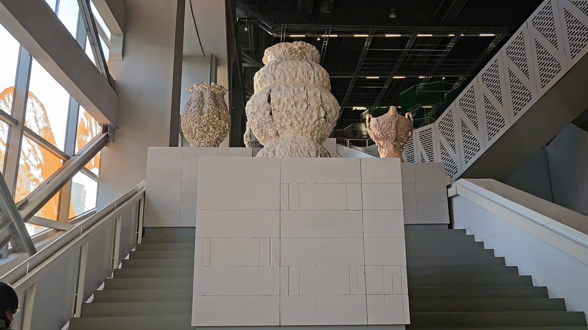 Tall pale sculpture in the atrium
