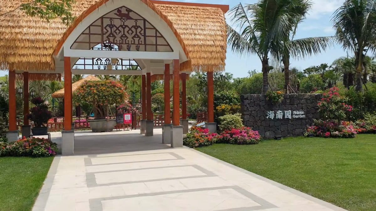 Thatched pavilion among tropical palms