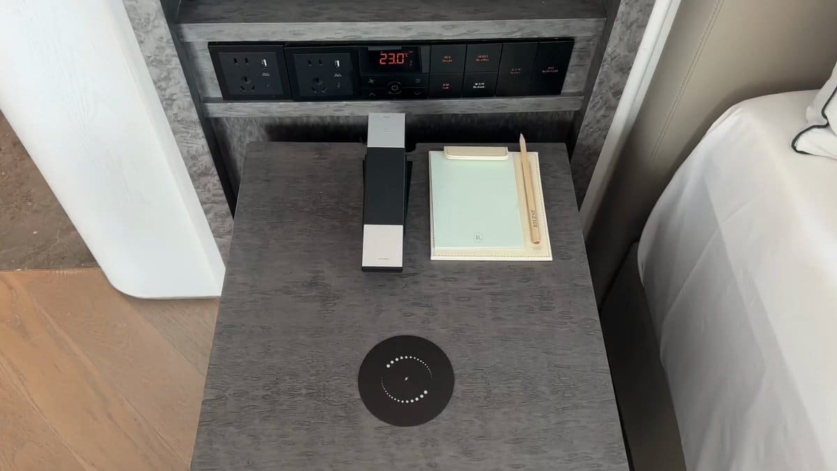 The bedside panel — switches and a temperature