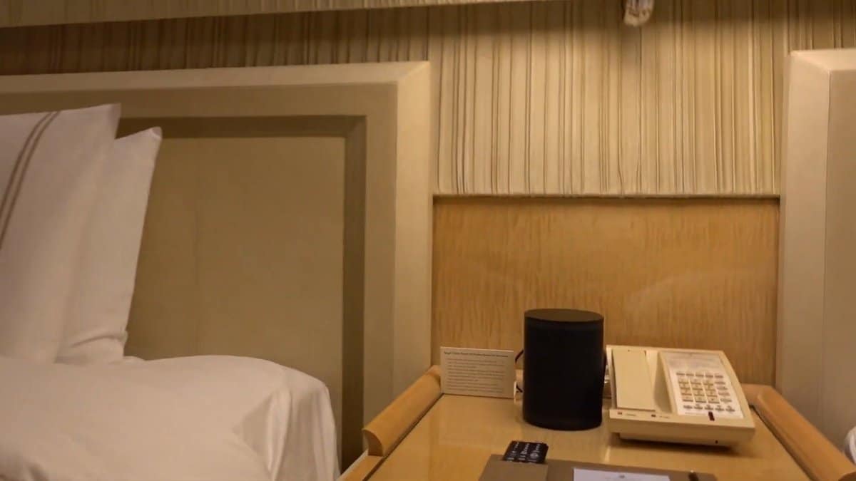 The bedside with a telephone and a small