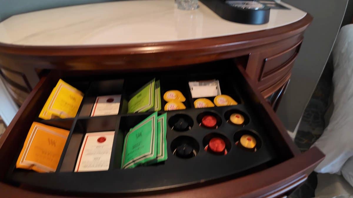 The console drawer pulled open, a black tray