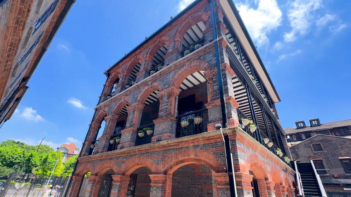 The corner of the brick building with its