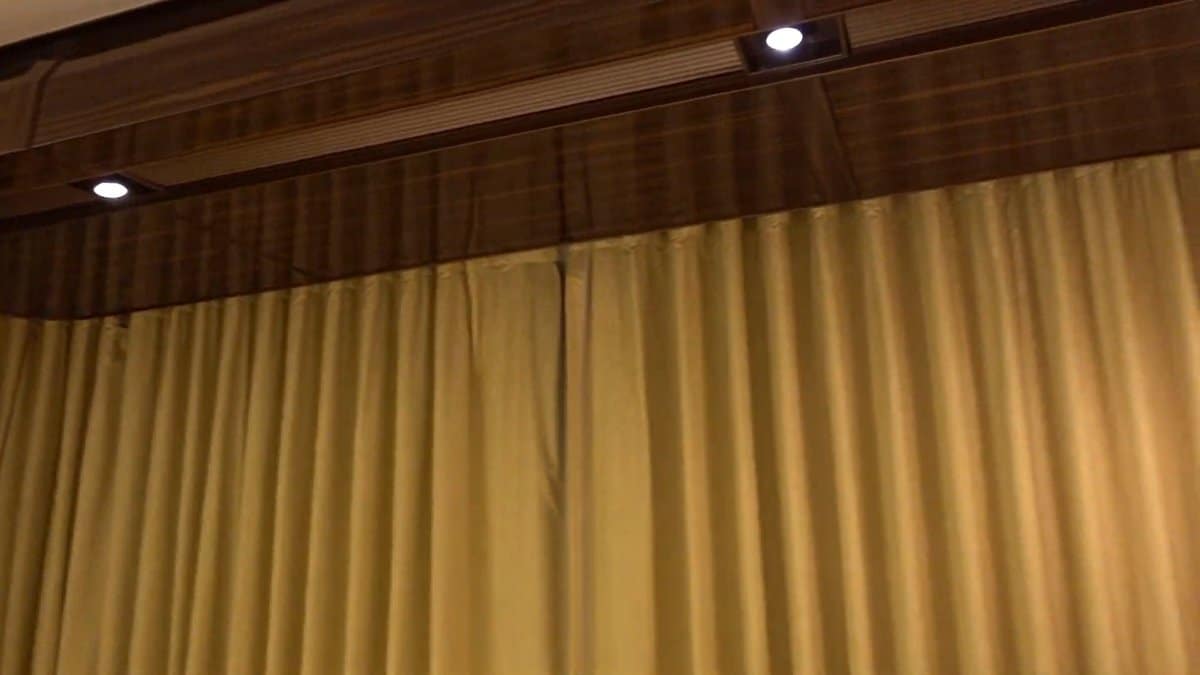 The curtains closed across the full width of