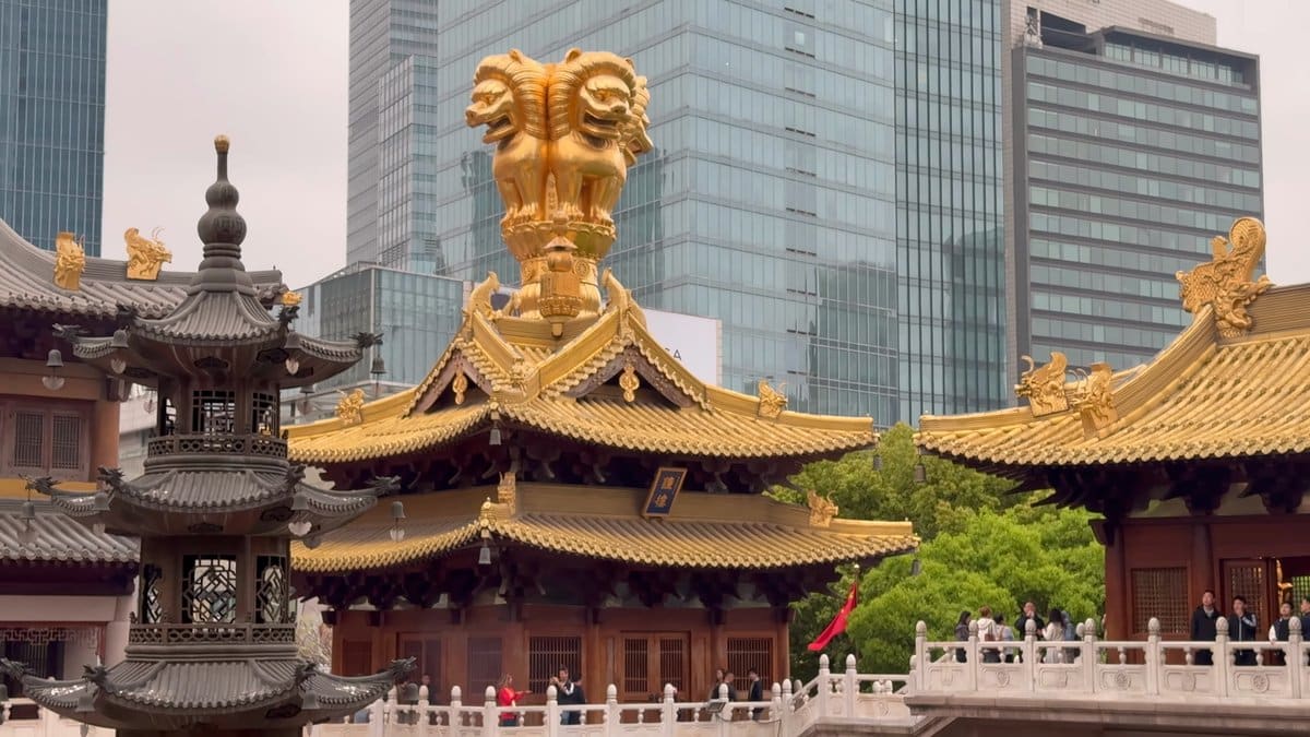 The dark bronze incense pagoda at the left