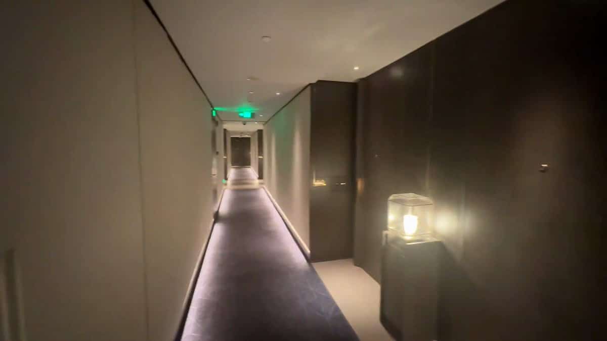 The guest corridor on the room floor, dark