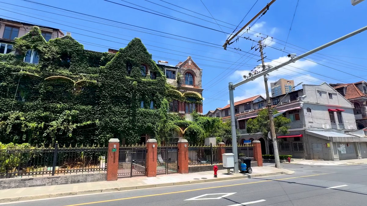 The ivy-covered building running along the street beneath