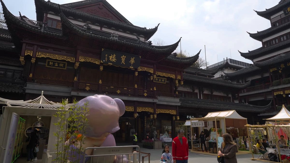 The lavender bear sculpture close to, canopy stalls