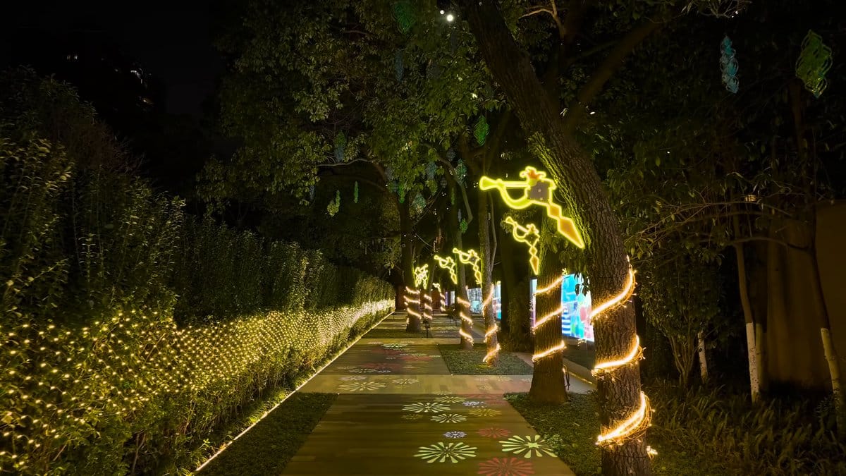 The lit path with a glowing screen at