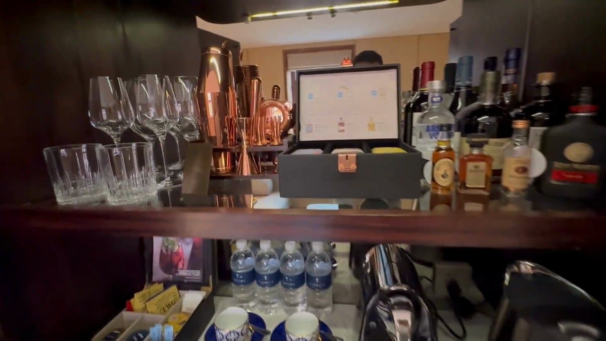 The minibar shelf, wine glasses and a copper