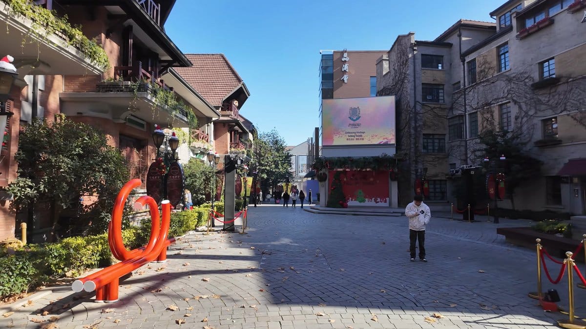 The open plaza with a large screen on