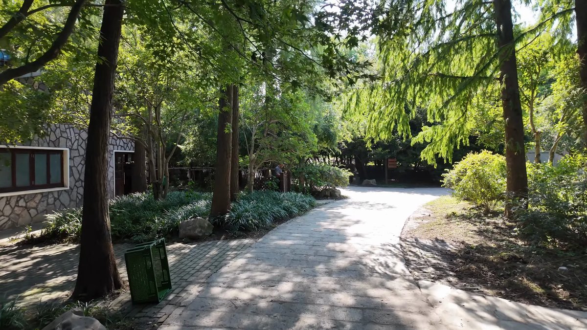 The path passing a small stone building with