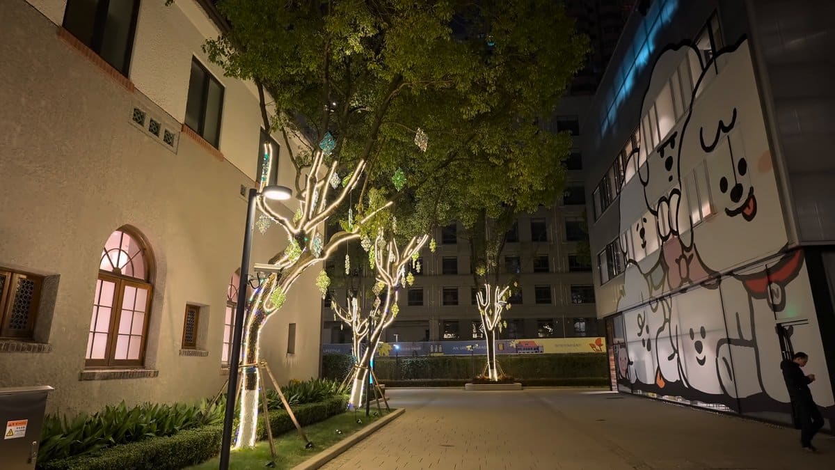 The plaza in front of the mural, lit