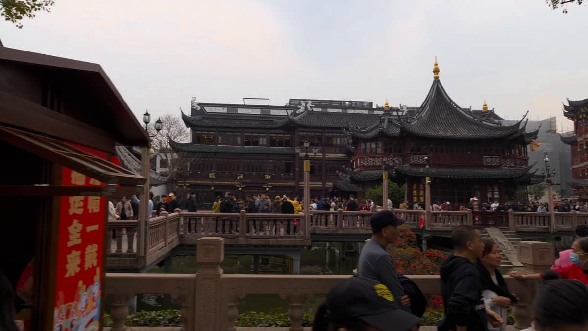 The pond with tiered buildings behind and a