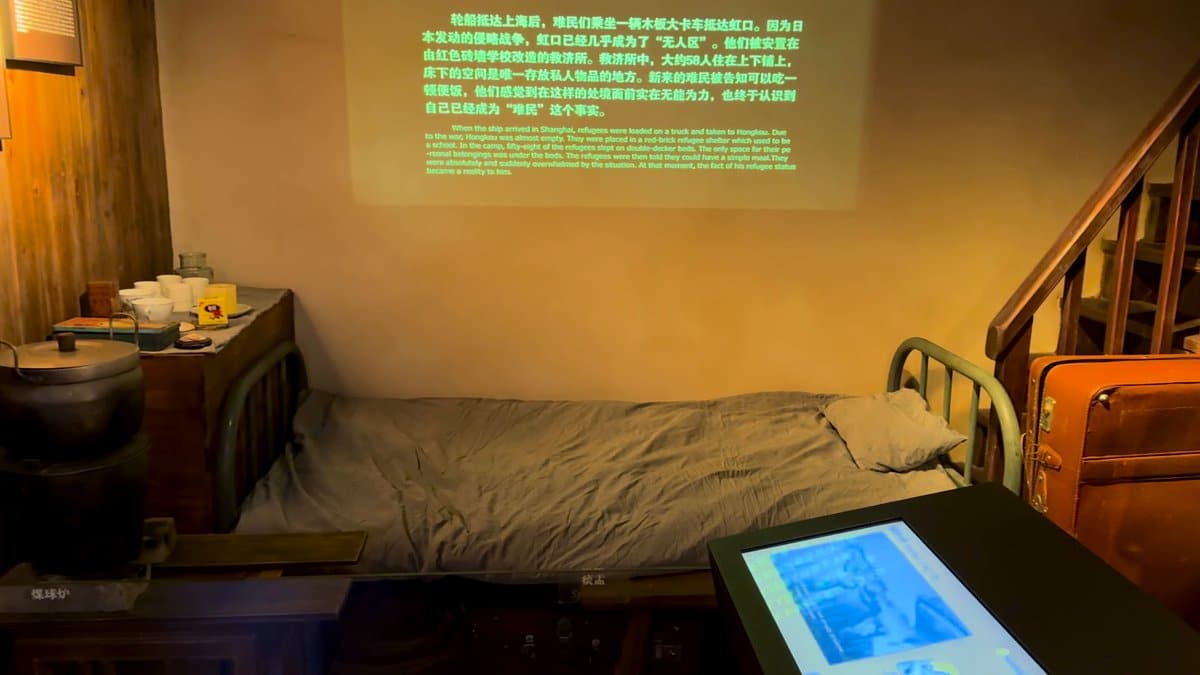 The recreated bedroom with the bed, a touchscreen