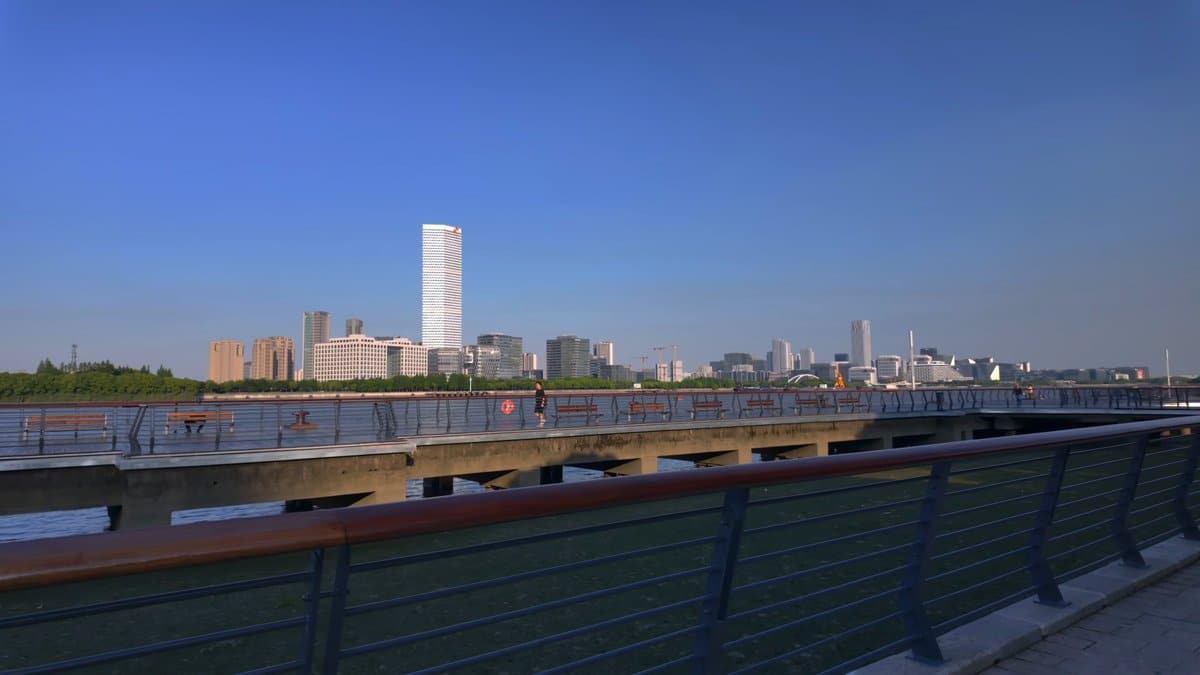 The riverside rail with the far bank and