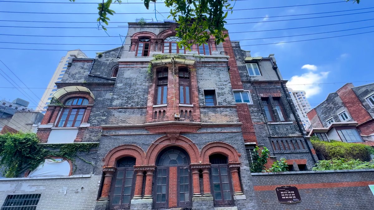 The same historic brick mansion with its arched