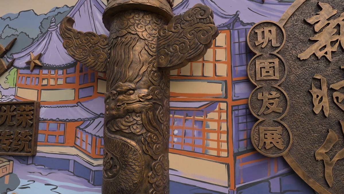 The same mural further along, the dragon column