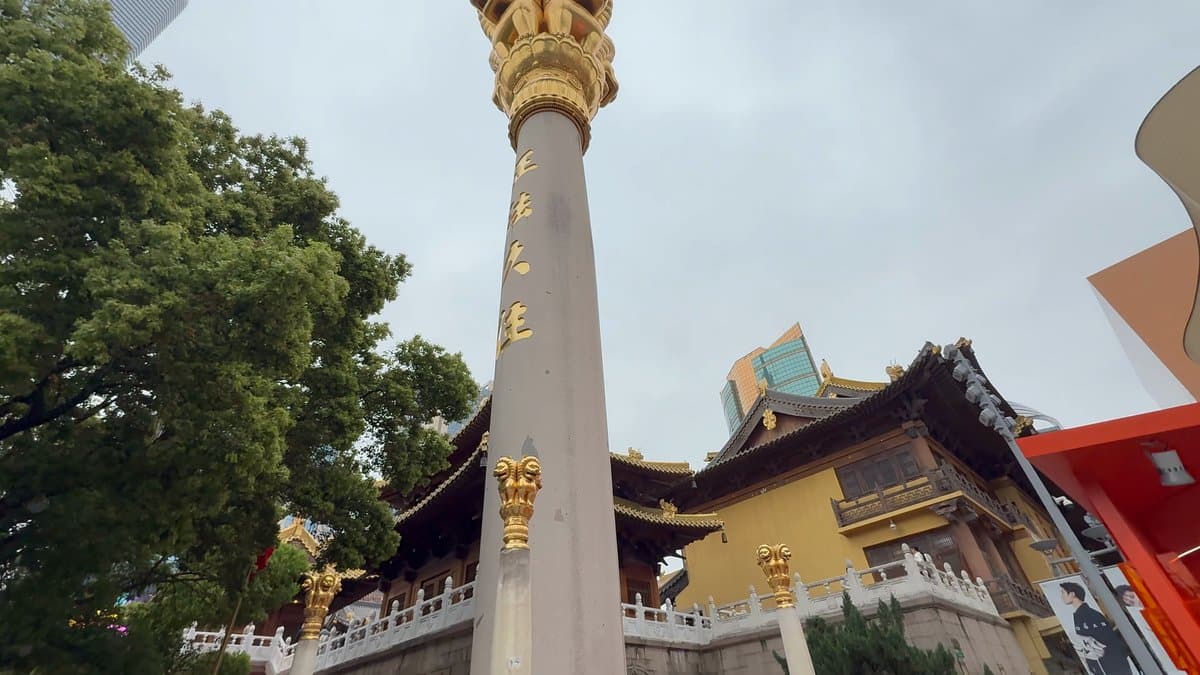 The stone column with its gilded beast finial