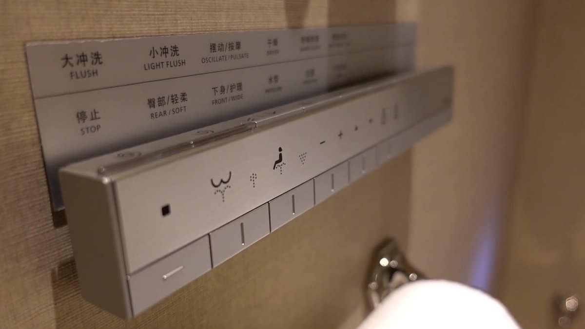 The washlet's wall panel in brushed steel, buttons