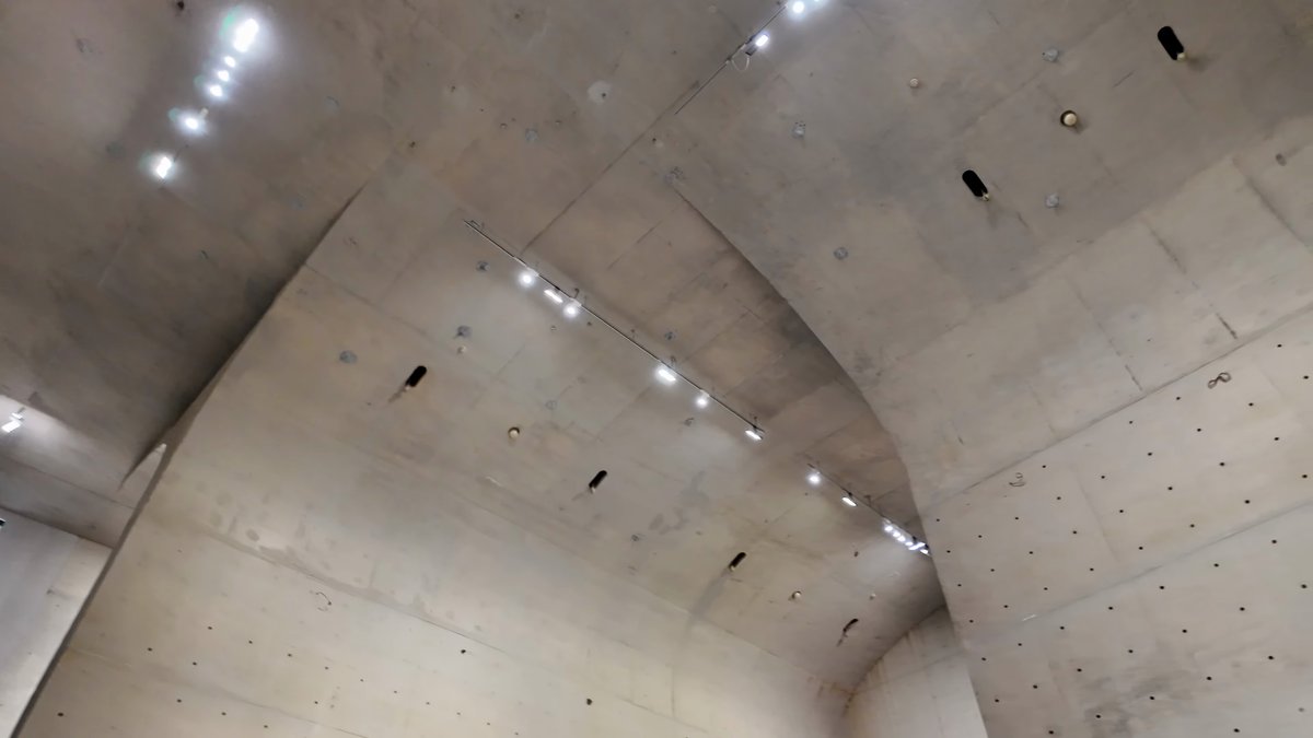 Track lighting along curved shells