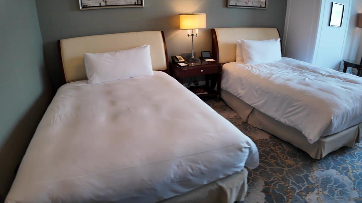 Twin beds turned down neatly