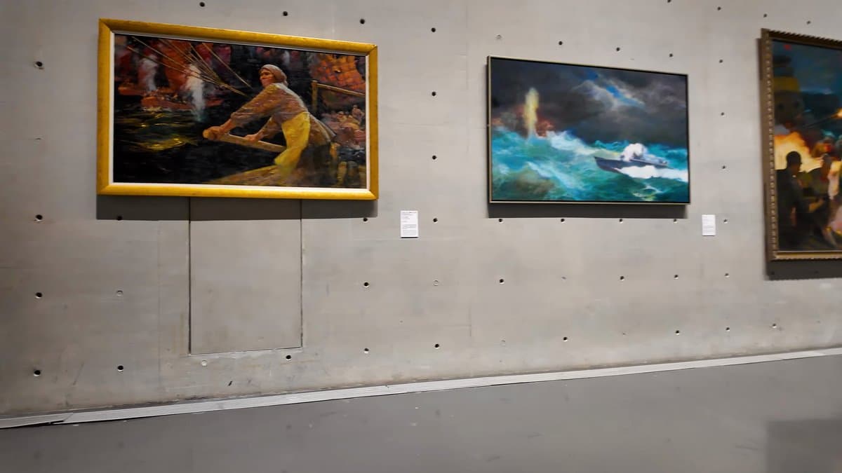 Two large canvases on concrete