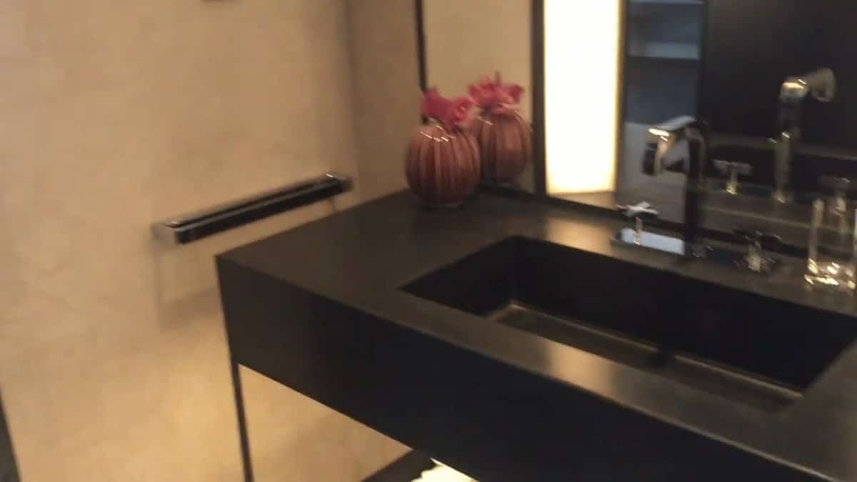 Vanity with rose-coloured vase